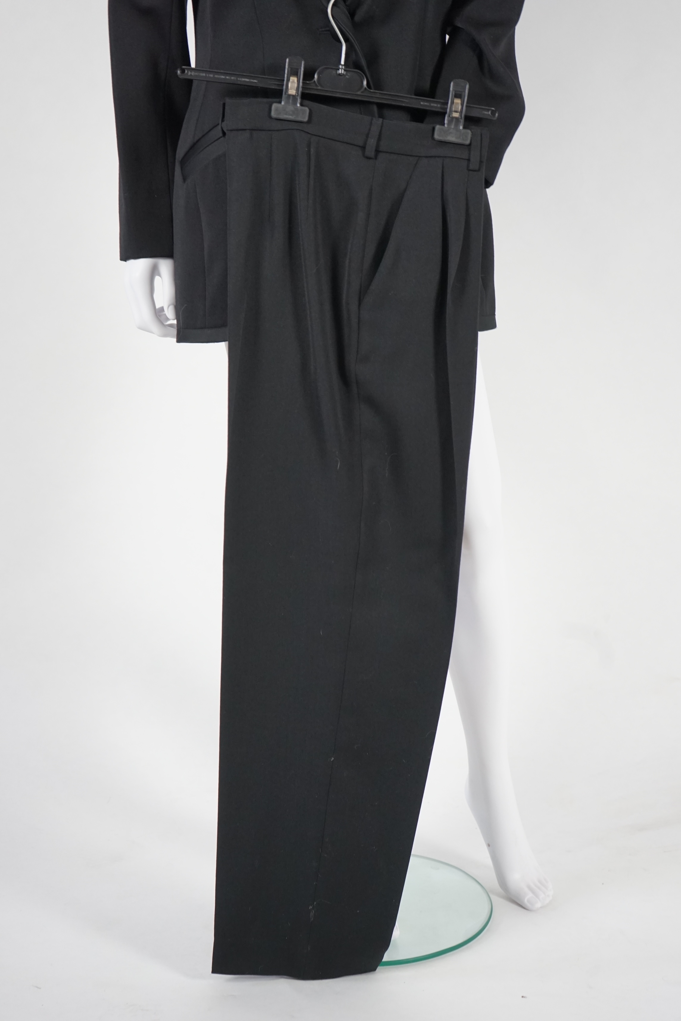 Two vintage Yves Saint Laurent lady's variation black trouser suits, F 42 (UK 14). Please note alterations to make the waist smaller may have been carried out on some of the skirts. Proceeds to Happy Paws Puppy Rescue.